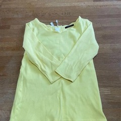 袋いっぱいの服  の画像