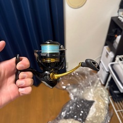 釣竿三本とリールの画像