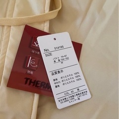 新品未使用タグ付黄色　ダウンジャケットの画像