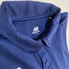 new balance ポロシャツの画像
