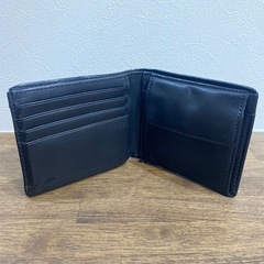 【COACH】本革 二つ折り財布（黒・シグネチャー柄）の画像