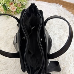 しまむらと辻希美のブランド「Ange Charme」がコラボレーションした、クロミちゃんのネームタグとサイドリボンが特徴の2WAYバッグの画像