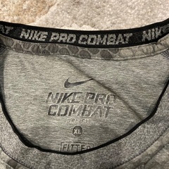 NIKE🟠シャツXLサイズの画像