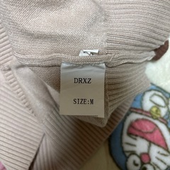 ダブルジップ　トップスの画像