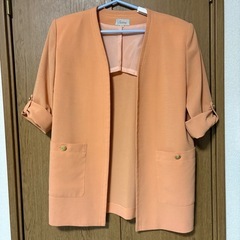 オレンジ ノーカラージャケット
の画像