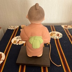博多人形　駒を持って遊ぶ子どもの画像