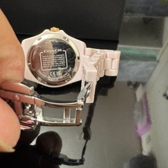 COACHピンクセラミック時計の画像