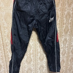 asics アシックス ナイロンウェア　パンツ ジャージ 黒 赤 白ライン　Lサイズの画像