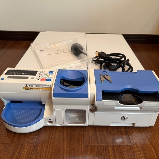 自動釣り銭機